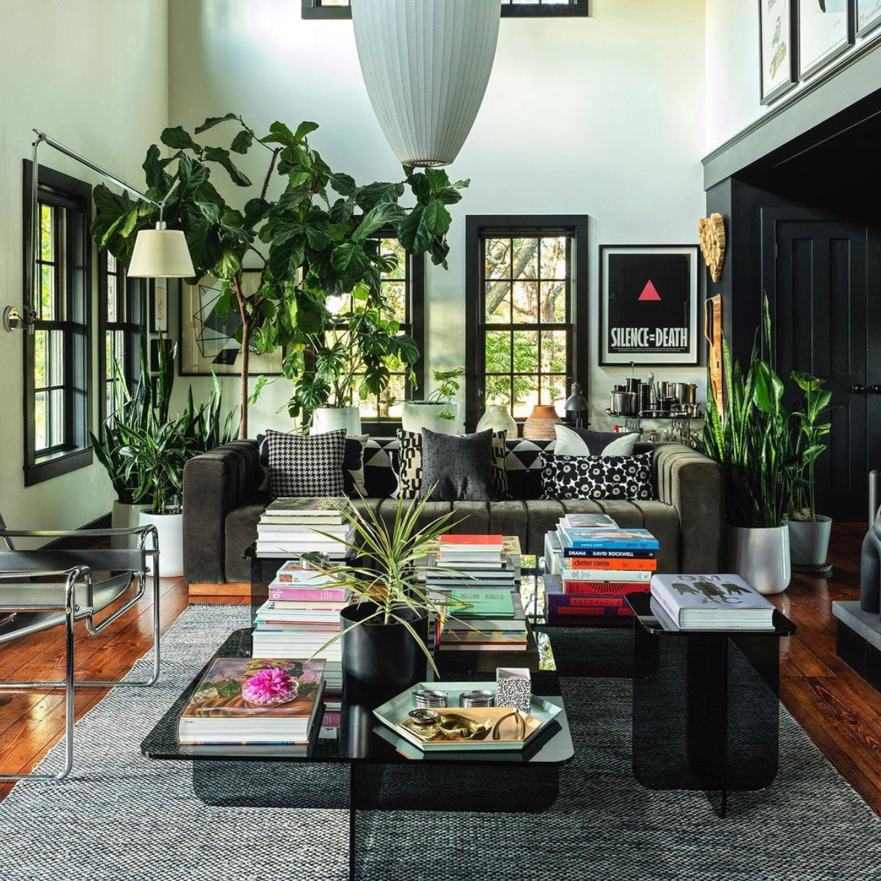 Modern living room with a greenish gray sofa, coffee table, and decorative items.