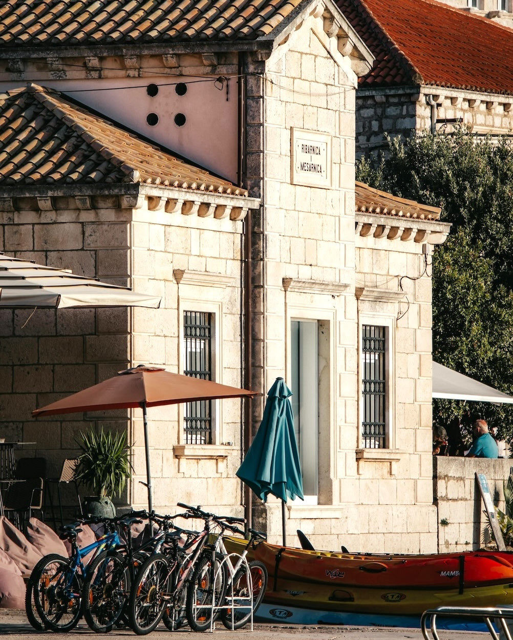 European stone building with bicycles parked outside
