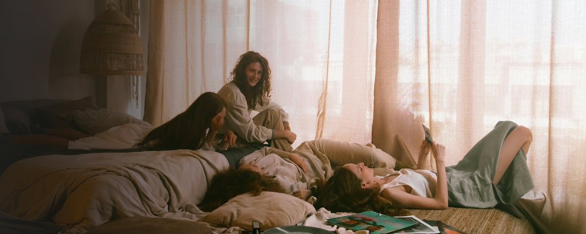 Women hanging out in bed