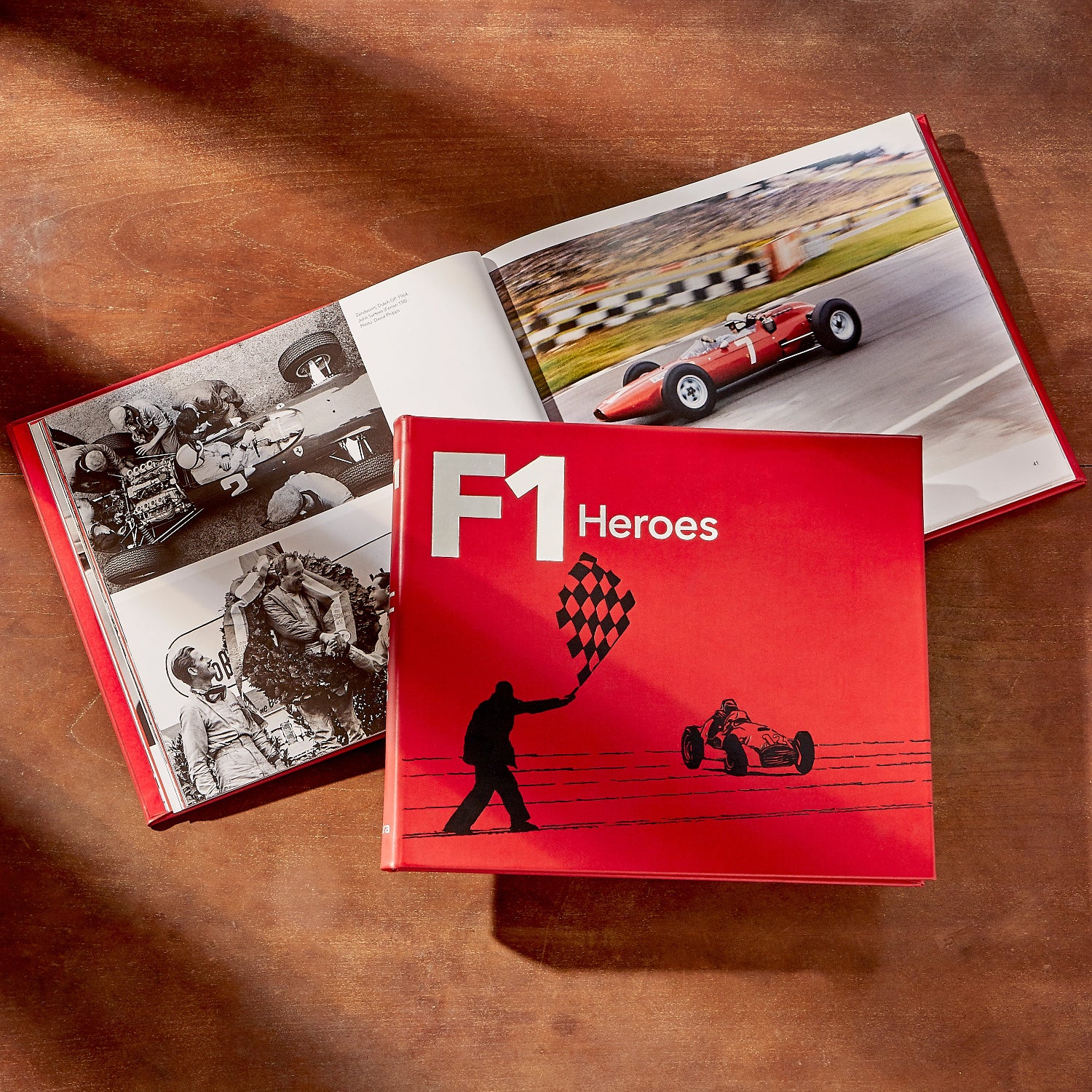 F1 Heroes book on wood table