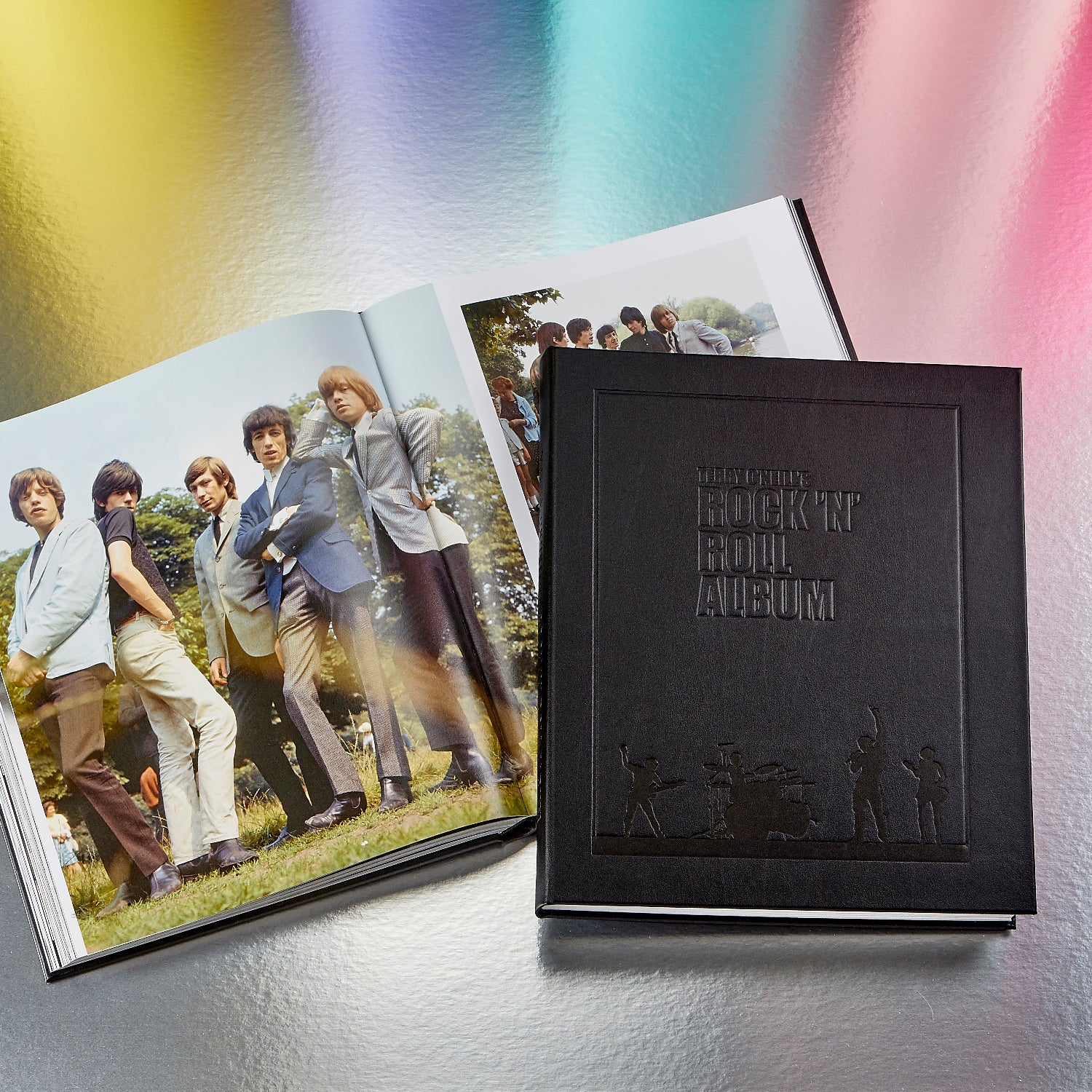 Terry O'Neill's Rock N Roll Album book on colorful silver surface