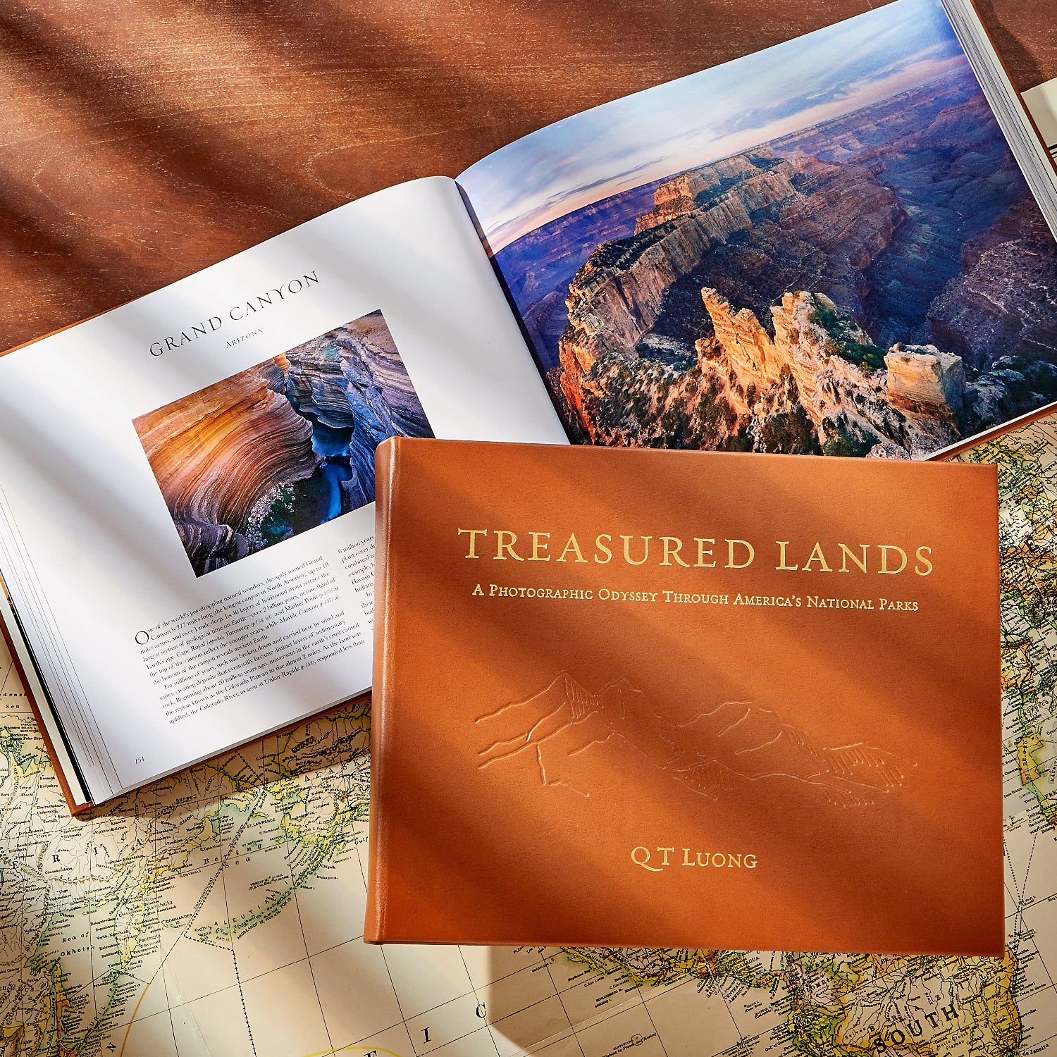 Treasured Lands book laying on a map