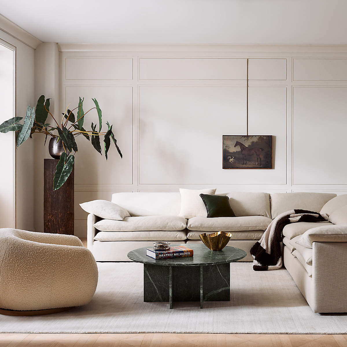 White neutral living room with green coffee table