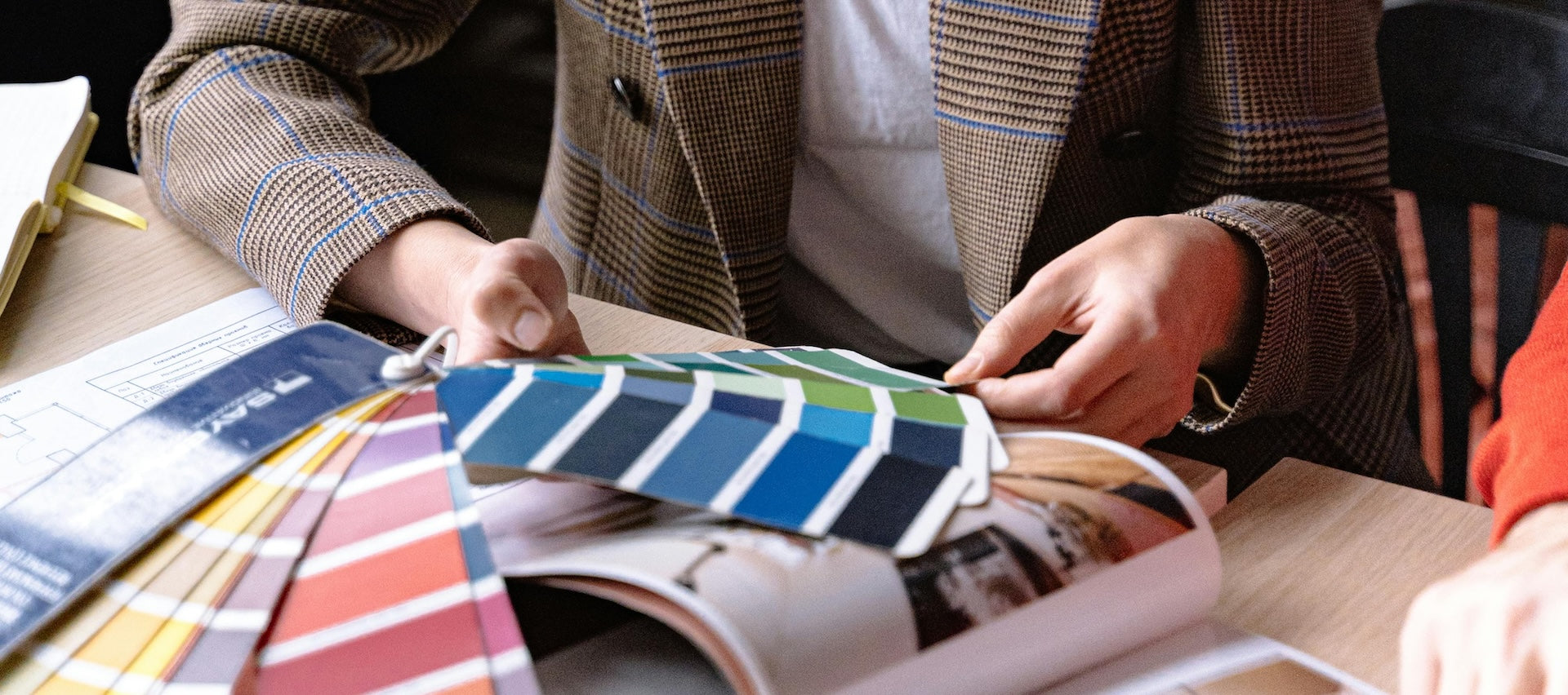 Interior designer looking at color swatches in an office setting