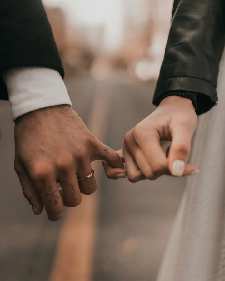 Two women holding hands closeup