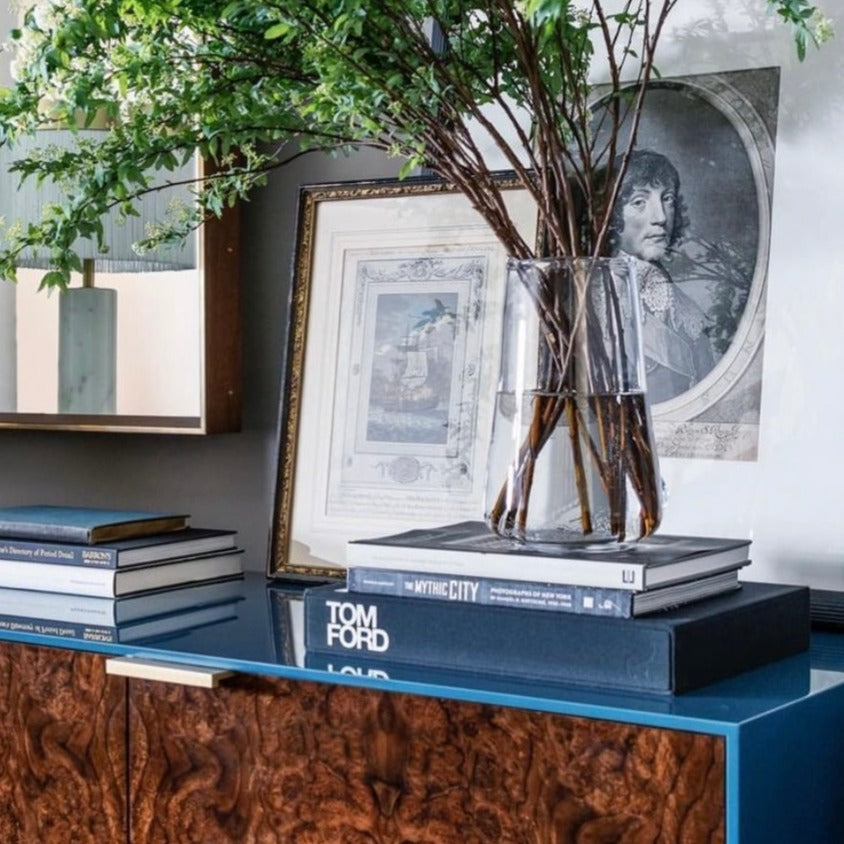 Blue wood cabinet table with tom ford coffee table book
